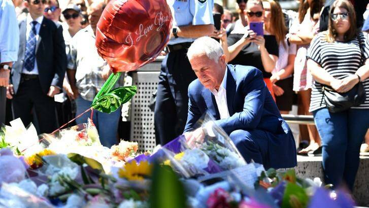 Prime Minister Malcolm Turnbull lays flowers in Bourke Street Photo: Joe Armao