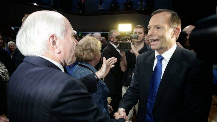 Tony Abbott has been haunted by WorkChoices, the policy of former prime minister John Howard. Photo: Alex Ellinghausen
