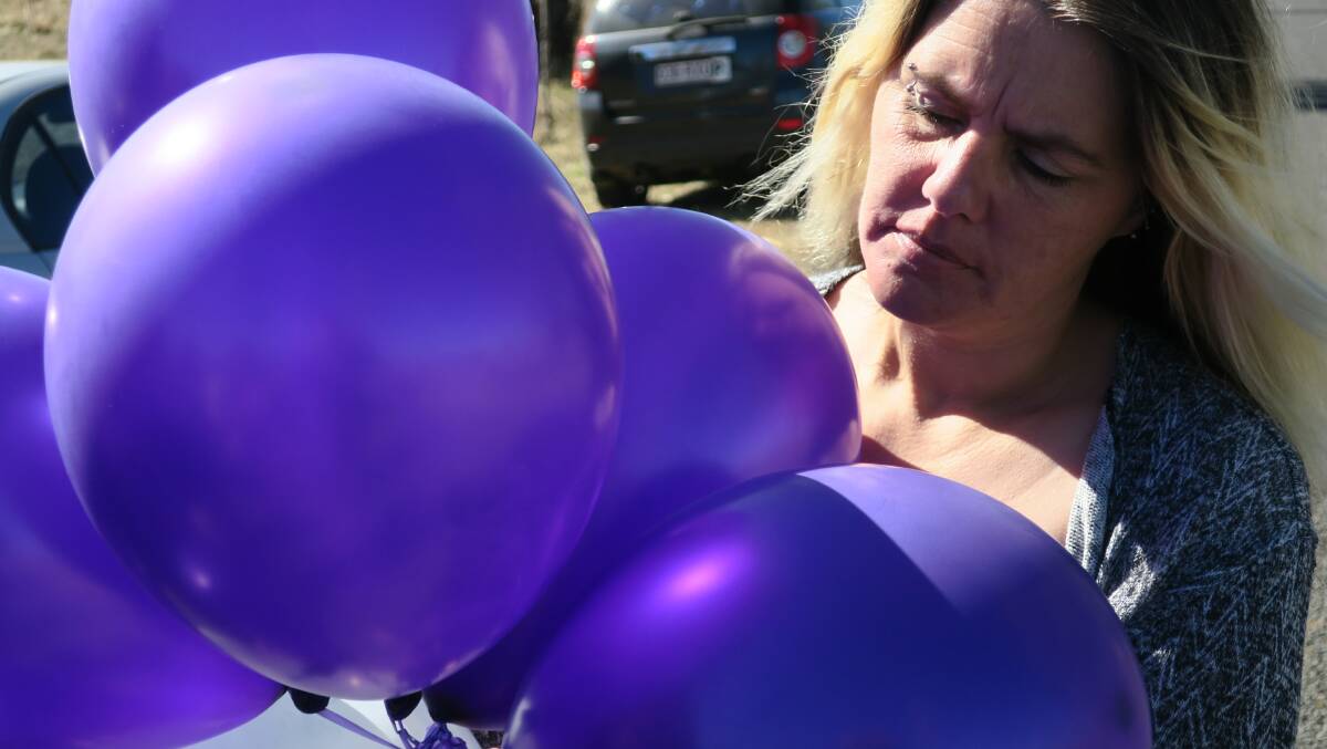 Friends of the 19-year-old passenger who died when the ute she was being driven in left the road and hit a tree on August 13 gathered to remember her at the site of the crash.  They released purple balloons - her favourite colour - and gave speeches.  She was remembered as "a girl with a big heart".