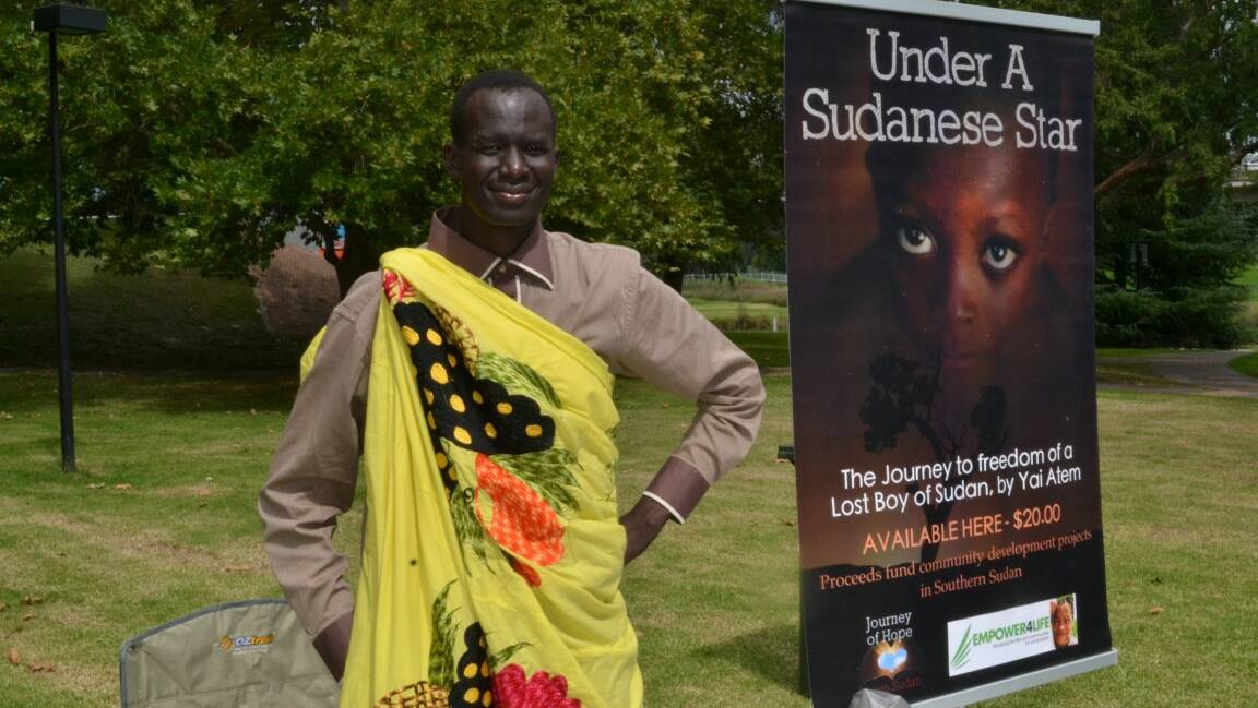 Yai Atem was selling his book Called "Under A Sudanese Star". Photo No 8572
