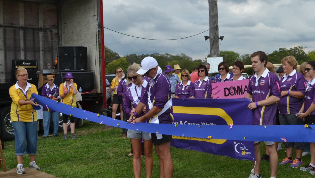 Beginning the Relay for Life Walk: Matt and Allana led the way for the Survivors and Carers. Photo No 8613