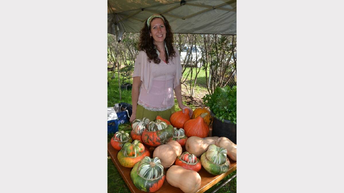 Sarah Priest with an array of pumpkins. Photo by Harold Konz No 8722