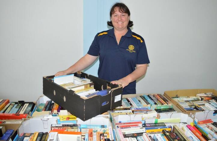 Inverell East Rotarians are dusting their hands after collecting about $8000 from the club's annual book sale on the weekend.
