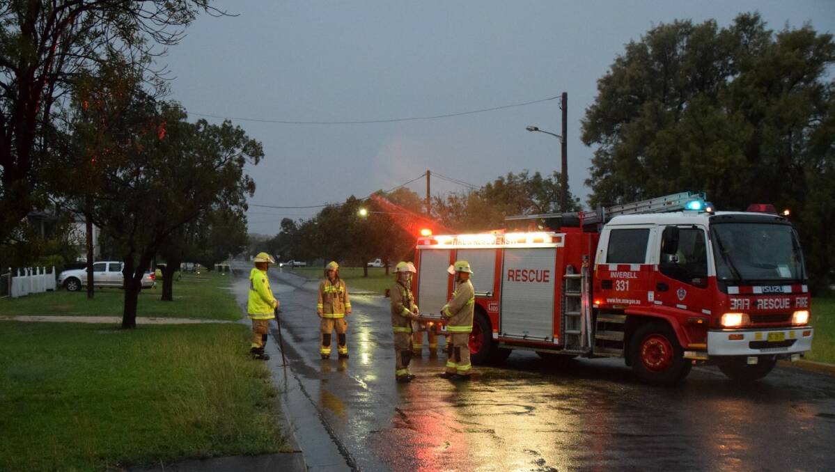 IN THE CLEAR: Members of NSW Fire and Rescue were called out to clear flooded drains.
