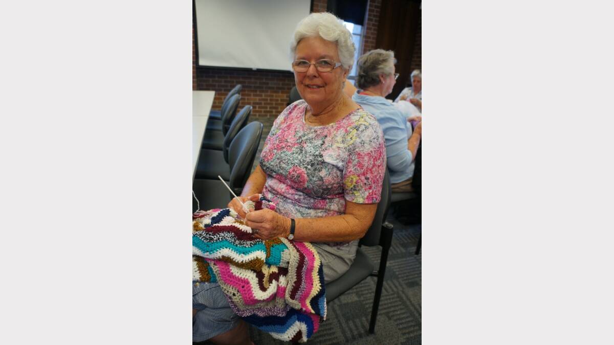 CREATIVE: A Library Knitter since the group’s inception, Beth Rainger skilfully pieces together a collection of different yarns to make a blanket. 