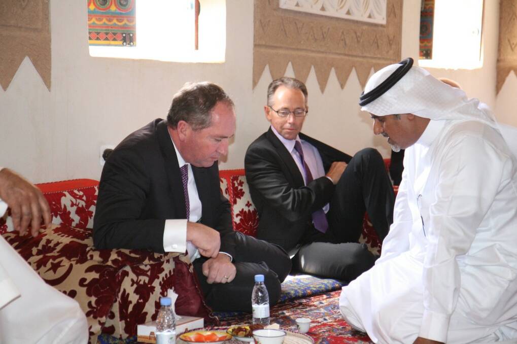 TRADE TALKS: Barnaby Joyce and Saleh A. Al Munajem, the Saudi Arabian Agriculture and Trade representative, take a meal break. Mr Joyce said every meeting in the Middle East came with a meal; camel, beef, lamb, beans, flat bread, rice, yoghurt and coffee till it hurts.