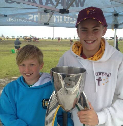 DREAMS: Paddy O’Brien and Hugo Percival got their hands on the Superrugby Cup for the first time.