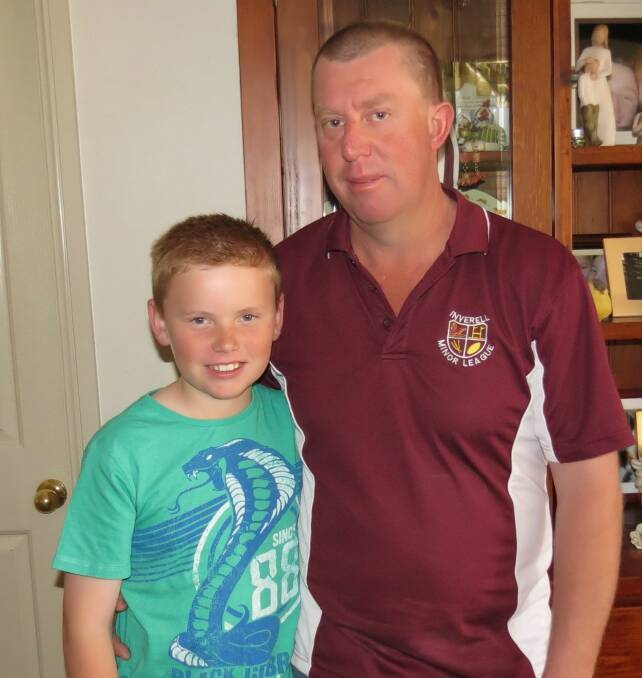 CALL FOR HELP: Riley Wighton with his father Robbie.