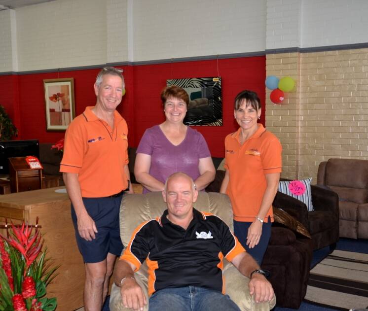 WINNERS: Andrew Daw is very confortable in his new recliner with Ian Rees, Lisa Daw and Michelle Rees.