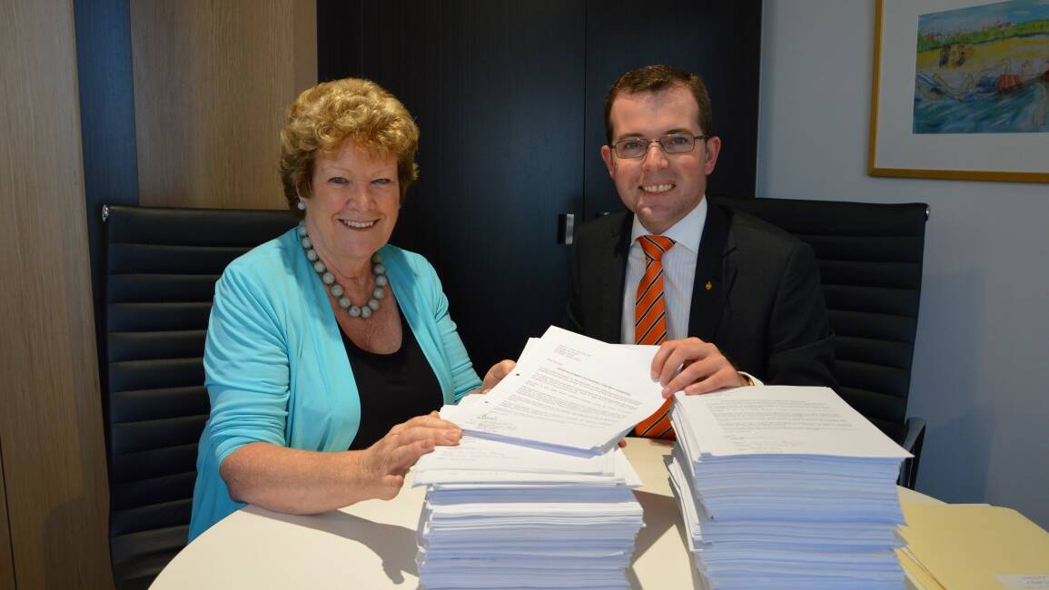 IMPRESSED: Minister for Health Jillian Skinner looks through the letters from Inverell, which were delivered to her office by the Member for Northern Tablelands, Adam Marshall.