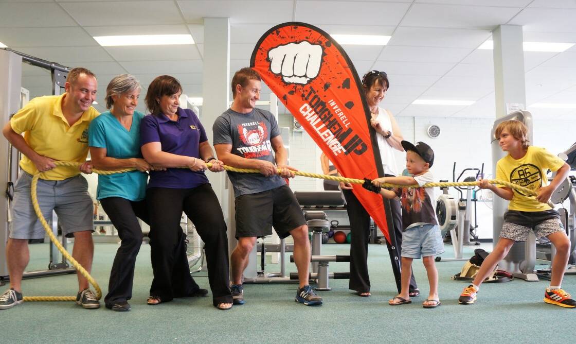 NO MATCH: Toughen Up Committee members Brett Pischke, Lisa Longhurst, Jacinta Marsh and Ben Lowe were no match for     strongman brothers Sonny and Cooper Pritchard, while Toughen Up founder and organiser Lynn Lennon looked on.