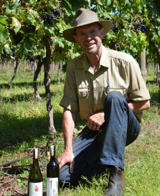 SUCCESS: Mark Kirkby with some his award-winning bottles in the vineyard.