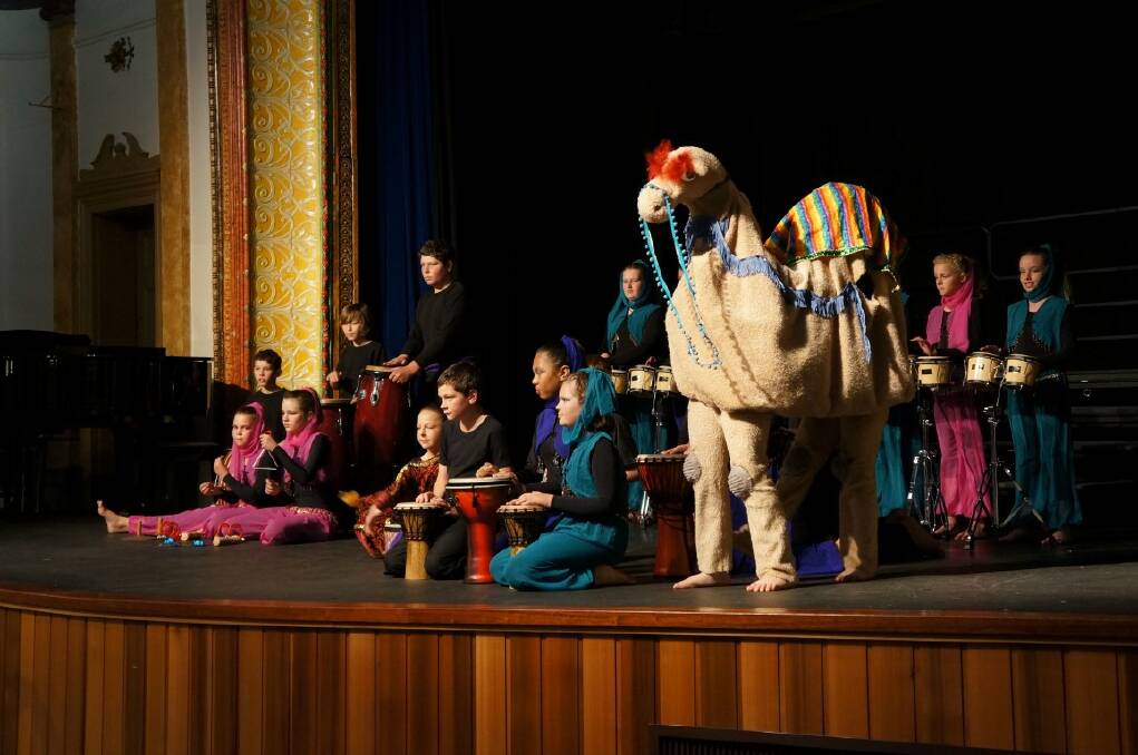 IMAGINATION: Inverell Public School students were joined onstage by a camel during their performance