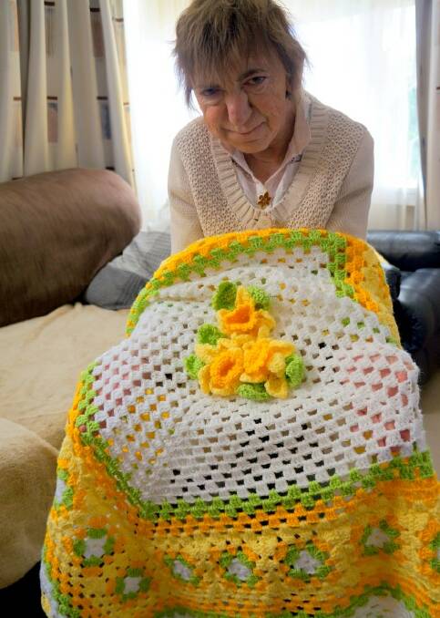 CENTREPIECE:Louise Barnes with a special item created by Ann Germany to raffle during this year’s Daffodil Day.
