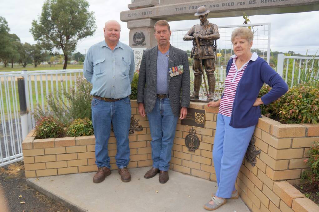 READY: Tingha RSL sub-branch president Dave Whitton, vice-president John Scanlon  and secretary/treasurer Audrey McArdle at the Tingha War Memorial, with its new centrepiece.