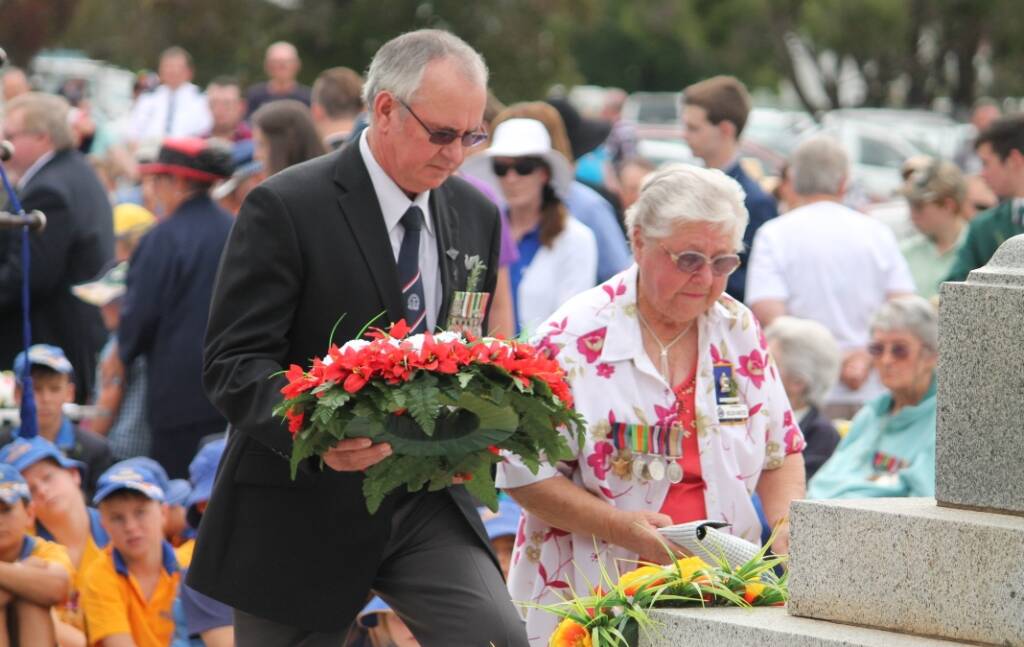 WREATH LAYING: Pat McMahon vice-president the Inverell RSL Sub Branch and Helen Anstee from Inverell RSL Women's Auxillary lay flowers at the cenotaph.