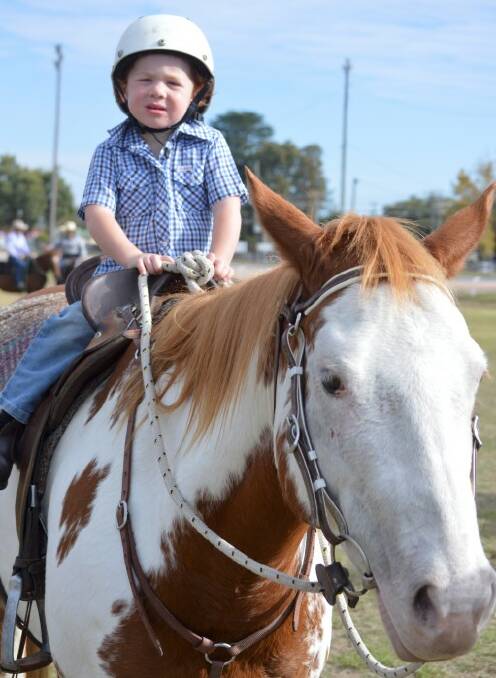 FAMILY DAY: Young Clay Henderson, riding ‘Dribbles’ at the Inverell Team Penning event.