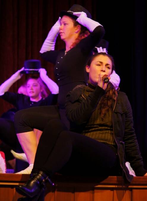 REHEARSAL: Megan Longhurst sings in front of dancers Taleah Byers and Lauren Mangano. 