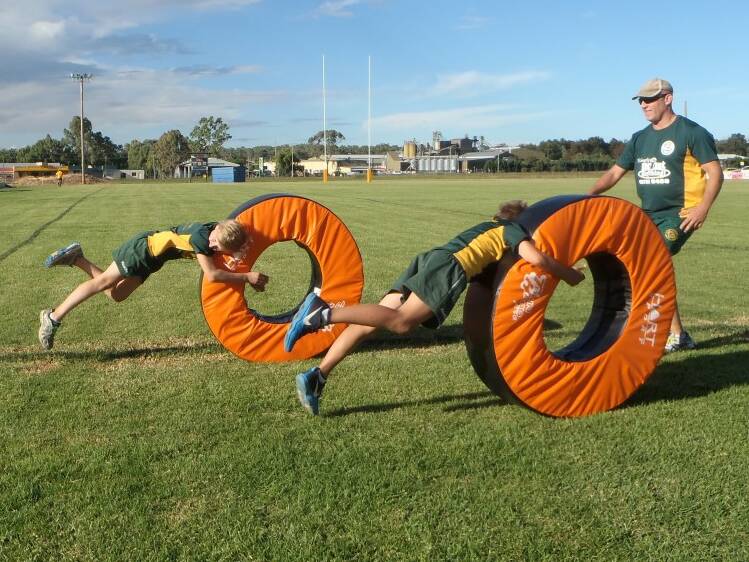 NEW EQUIPMENT: Will and Paddy O’Brien road test the new Hart Sports try-saver tackle rings.