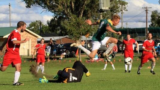 RAIDER: Ashley Smith in one of his devastating attacks on the Gunnedah goal. He finished the game with four goals.