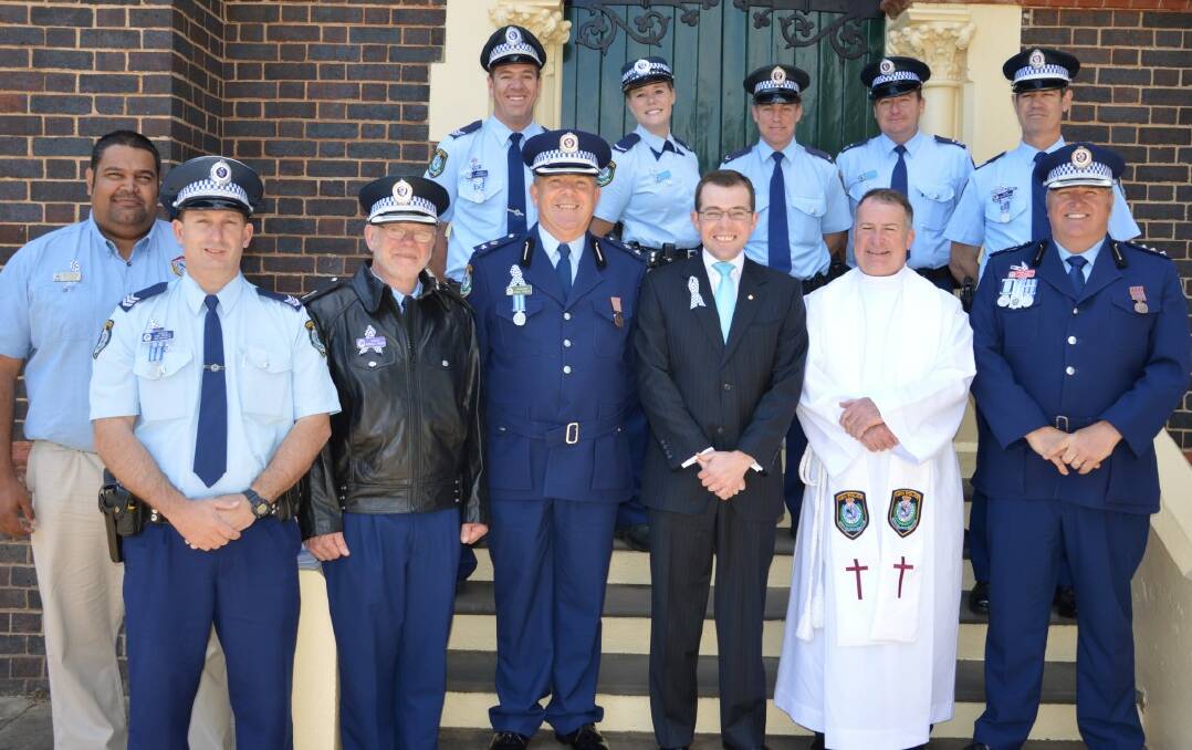 HONOUR SACRIFICE: The Inverell Police contingent at the National Police Remembrance Day service in Glen Innes (back from left) Sergeant Jay Tuckwell, Constable Ashleigh Michael, Constable Shaun Phillips, Senior Constable Greg Dillow, Sergeant Andrew McKay, (front) Aboriginal Community Liaison Officer Matt Cutmore, Sergeant Tim Mowle, Police Chaplain Pastor Randall Gauger, New England LAC Commander Superintendent Fred Trench, Northern Tablelands MP Adam Marshall, Police Chaplain Father Anthony Koppman and Inverell Duty Officer Inspector Rowan O'Brien.