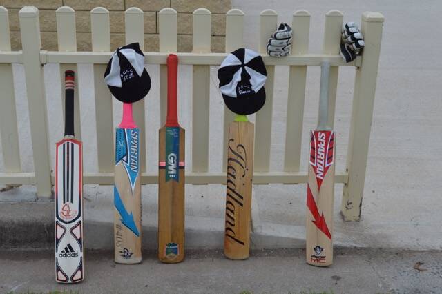 PUT OUT YOUR BATS: Five cricket bats were placed against the Varley Oval fence in tribute. PHOTO by HAROLD KONZ