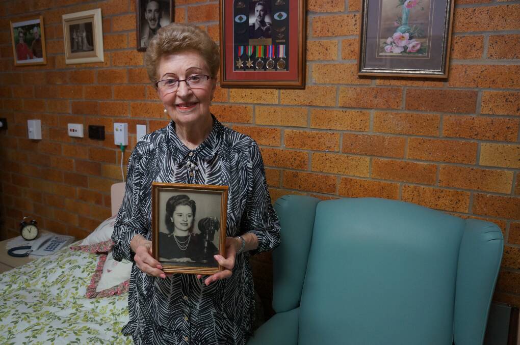 THE VOICE: Joan Hockey with a portrait of her that ran in the ABC Weekly from around 1945.