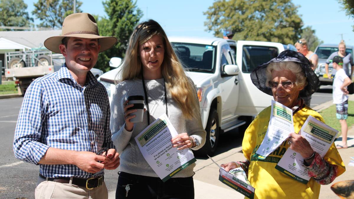 ELECTION DAY: Adam Marshall with Megan Debreceny and Fanny Smith at Ross Hill Public School on Saturday.