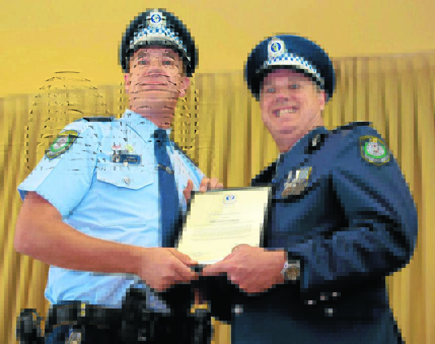 SERVICE: Sergeant Jay Tuckwell receives his Western Region Commendation for bravery from Western Region Police Commander, Assistant Commissioner Geoff McKechnie 
