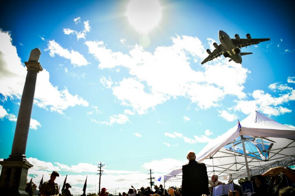 The Boeing C-17 Globemaster makes a low pass over the Inverell cenotaph. Photo: SIMON McCARTHY.