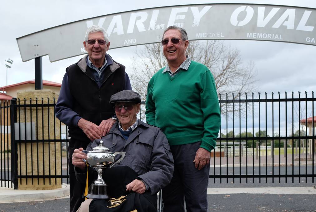LIVING HISTORY: John Henderson, Col Campbell with the cup, and (seated) the original player with his champion’s blazer, Alan Mather.