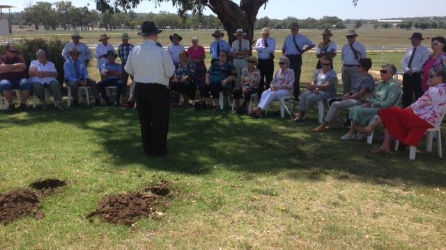 REMEMBERED: Brian Baldwin speaks at Saturday morning’s service at Inverell Racecourse where a tree was planted in honour of Bede Thomas.