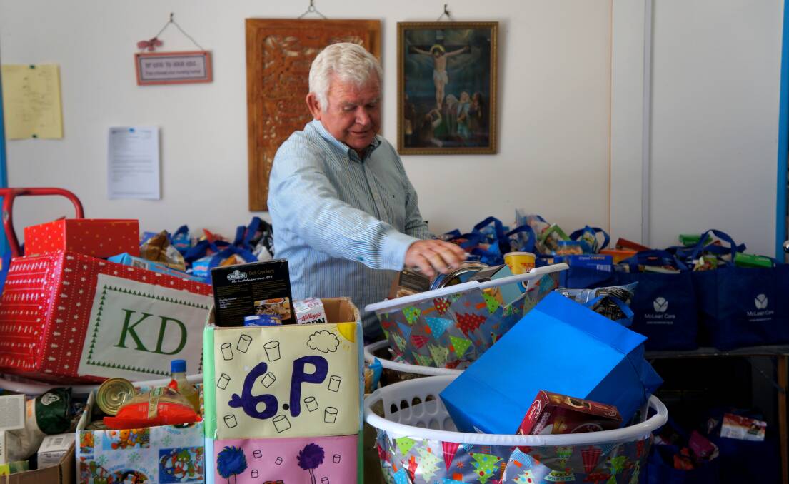 Ian Witherden among the masses of donations for this year’s St Vincent de Paul’s Christmas appeal.