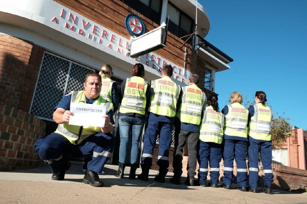 REACHING OUT: Inverell-based NSW Ambulance paramedic Clint McSpedden and his colleagues in protest on Wednesday outside the Inverell ambulance station.