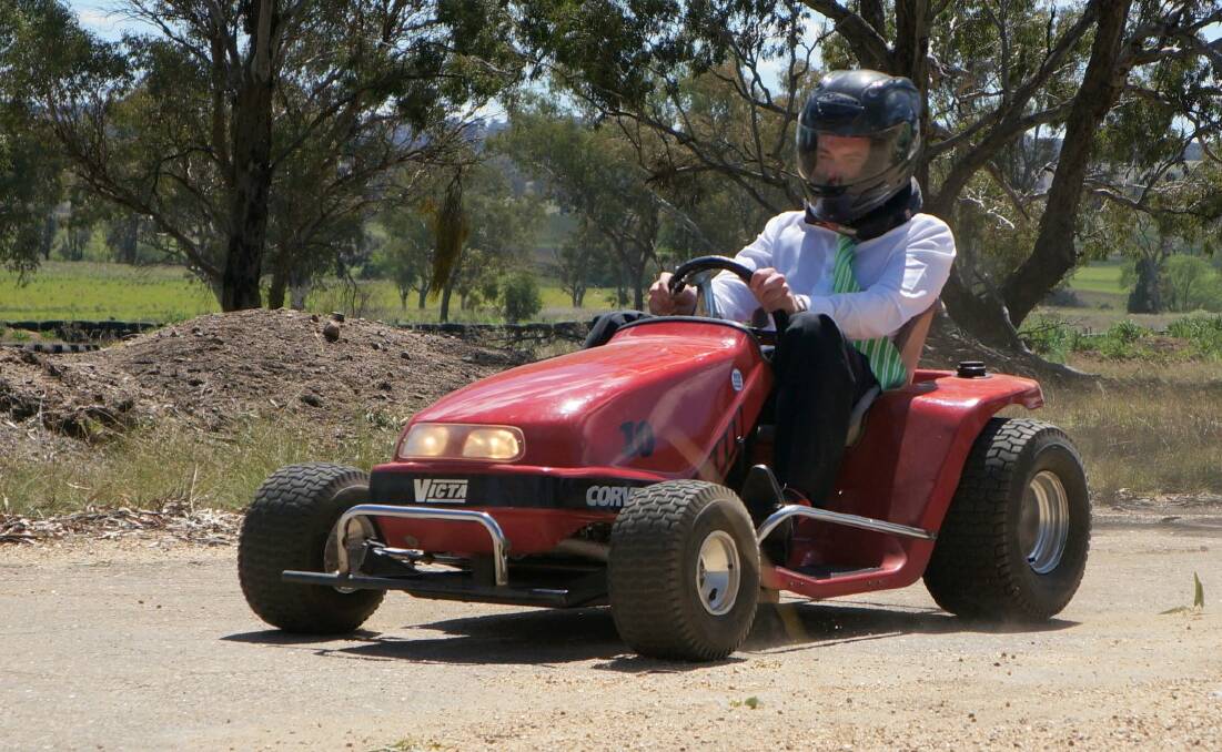 Northern Tablelands MP Adam Marshall took to the track on a 20hp, cherry red Victa racer.
