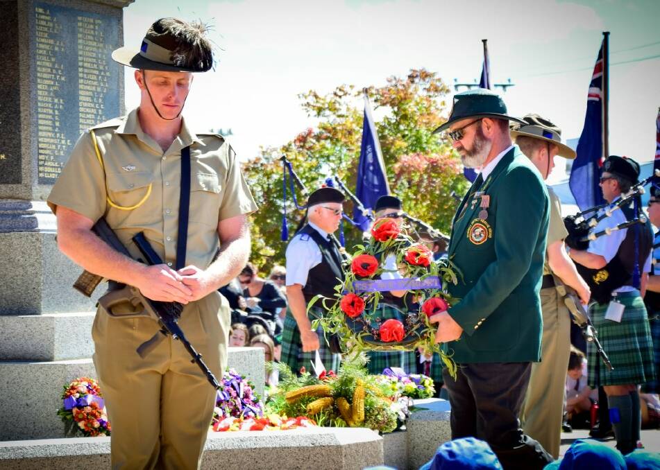 Inverell VRA's Jason Tom lays Kylie's KCL Daycare's wreath at the Inverell cenotaph. Photo: SIMON McCARTHY