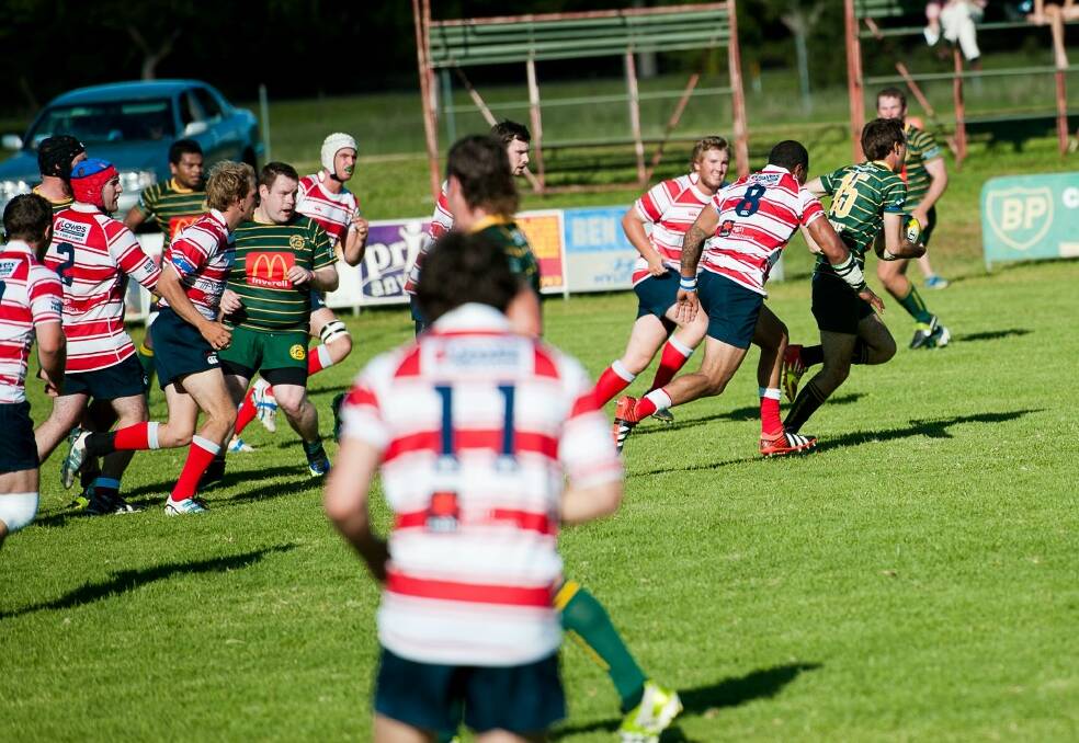 CLASH: An Inverell player runs the ball when the Highlanders took on Walcha in Round 2, in April this year.