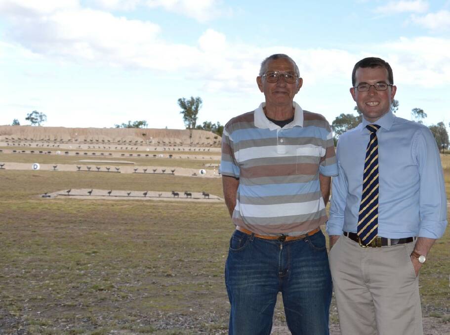 Member for Northern Tablelands Adam Marshall with Inverell RSM Pistol Club president Bevan Hertrick at the range last weekend.