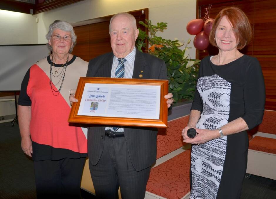 TOP HONOUR: Brian Baldwin receives the Communicator of the Year award from Ann Mason, Toastmasters’ vice president of public relations, and Margaret Payne, president of Inverell Breakfast Toastmasters Club.