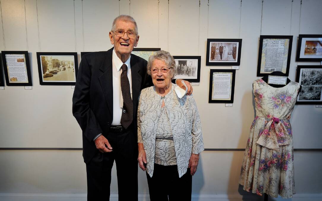 CHERISHED:  The Inverell Town Hall holds special memories for Bill and Cath Barry who met outside the building in 1945. Their story and wedding photograph features behind them in the exhibition.
