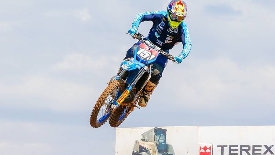 UP AND AWAY: Nick Sutherland rides hard and becomes airbourne during motocross comptetion. 