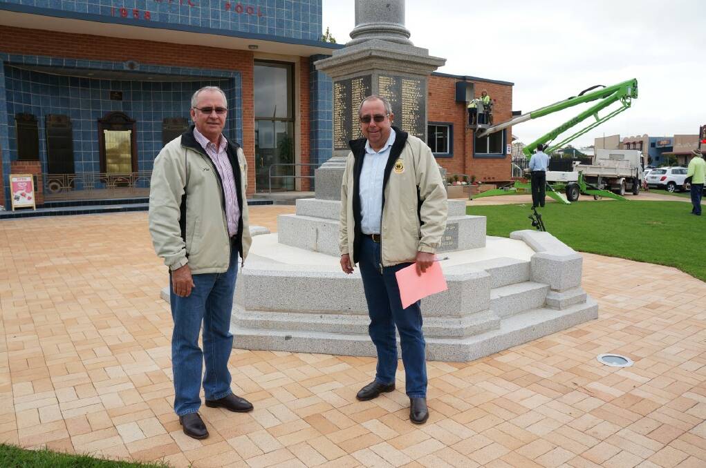  Inverell RSL sub-branch president Pat McMahon and secretary Graeme Clinch among the fray on Monday afternoon as council workers got the PA system set up.