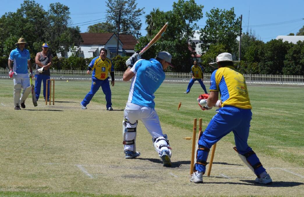 The Aussies Nathan Fisher is bowled by Billy Russell of the Royal Rats.