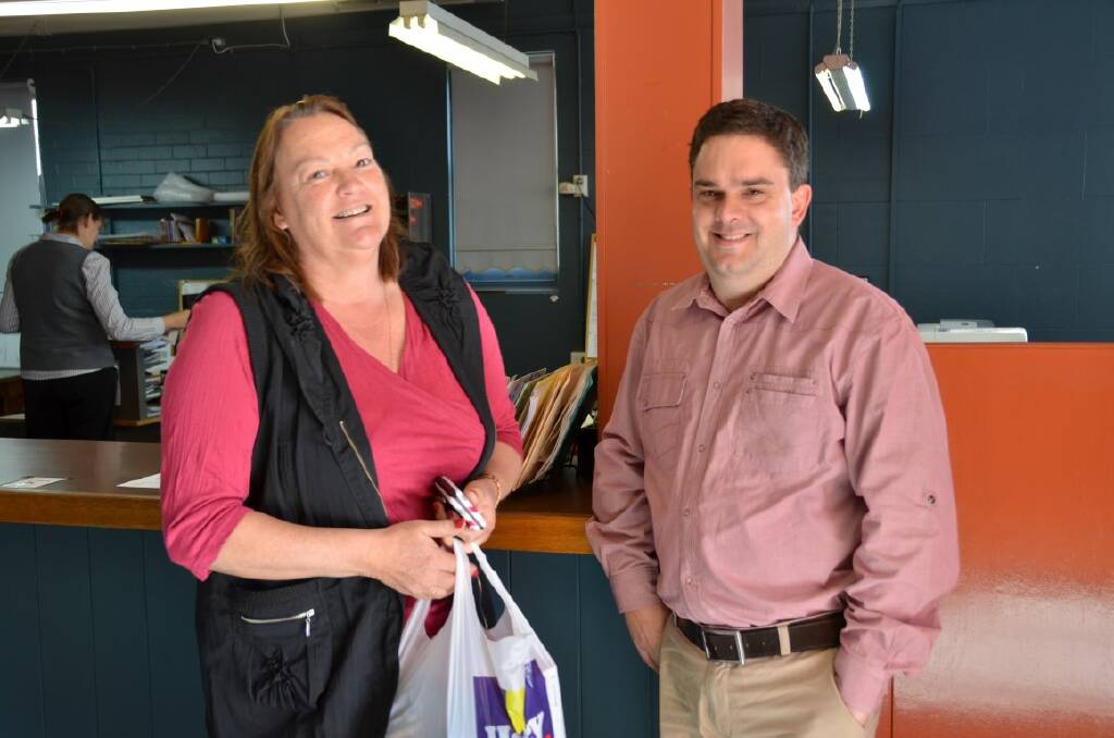 WINNER: Susan Woods collected a new camera on Tuesday morning from Inverell times editor Laurie Bullock.