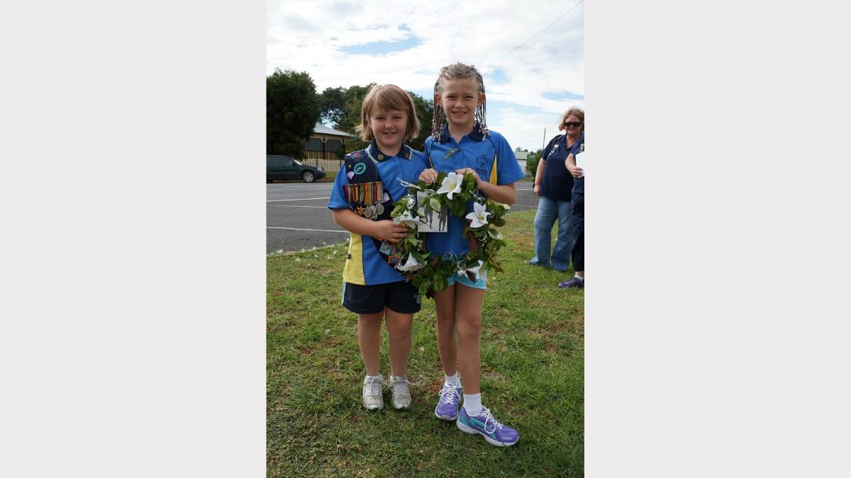 Delungra Girl Guides Breanna Johnson and India Barratt had a wreath to lay for the Girl Guides. Breanna was wearing the medals of her great-grandfather, William McInerney.  Pic 8