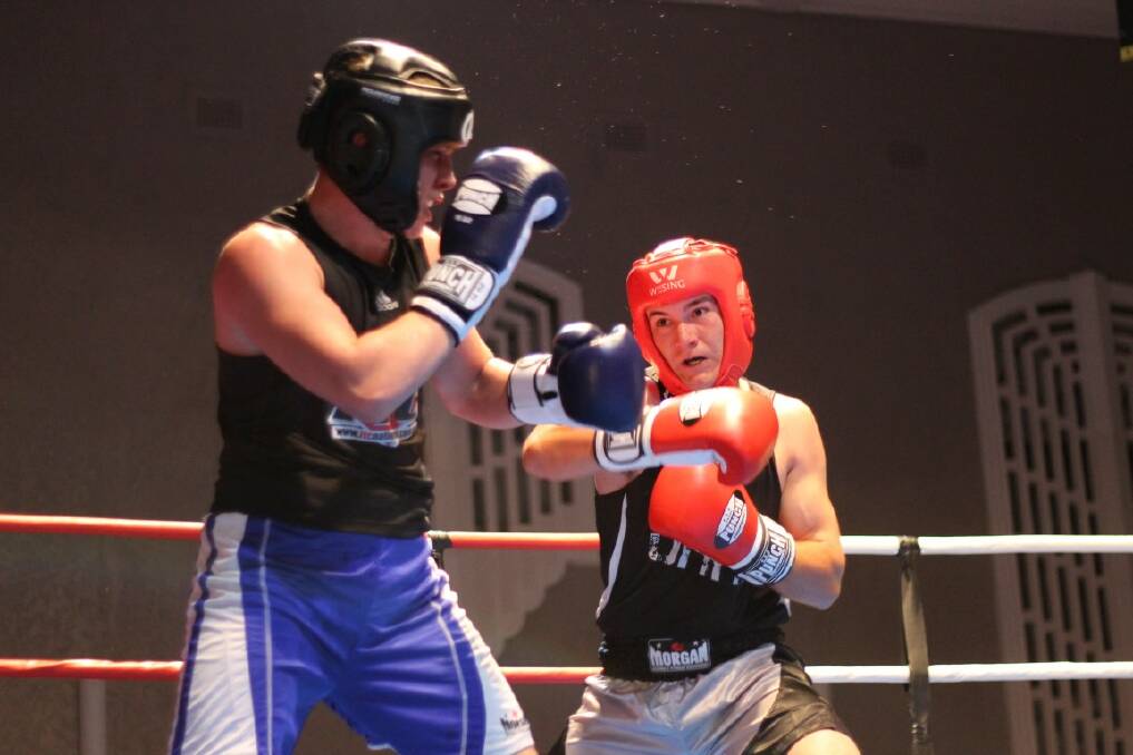 Blake Krauss (red) in form against Gunnedah boxer Shawn Hanslow.