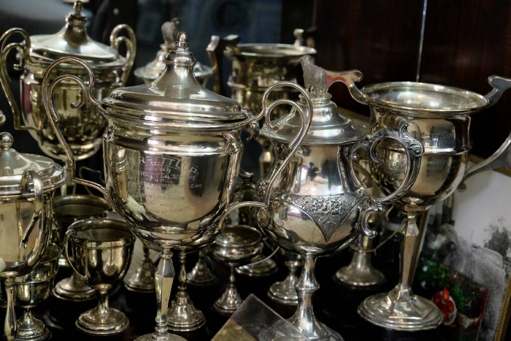 Some of the Kent family trophies, reaching back more than 50 years.