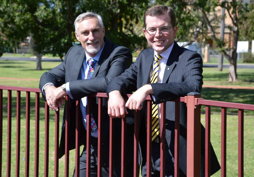 Inverell Shire mayor Paul Harmon and Member for Northern tablelands Adam Marshall stand on the site of the new liberty swing for the disabled in Inverell's Victoria Park.