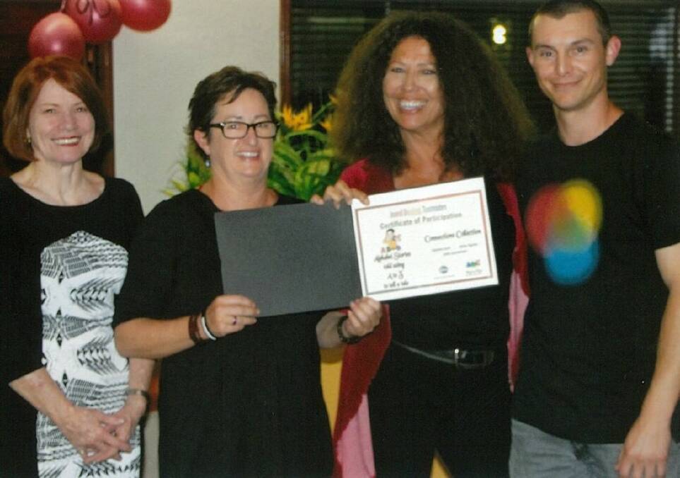 Margaret Payne, president of Inverell Breakfast Toastmasters Club presents the judge's award on the night to the Connections Collection team of Robbie Duff, Sally Sanderson and Toby Kauter.