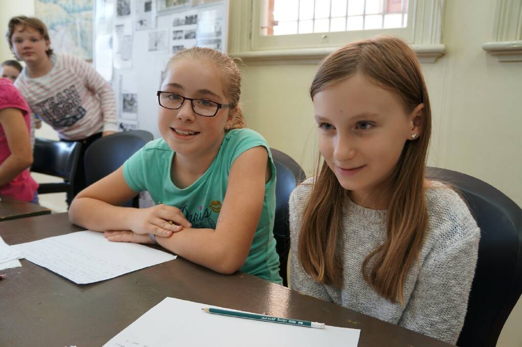 Emma Harmon and Kaitlin Hutchings were writing their stories.